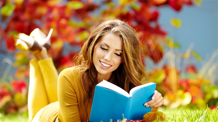 Woman Reading a Book in Fall