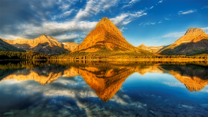 Mountain reflected in lake at sunrise