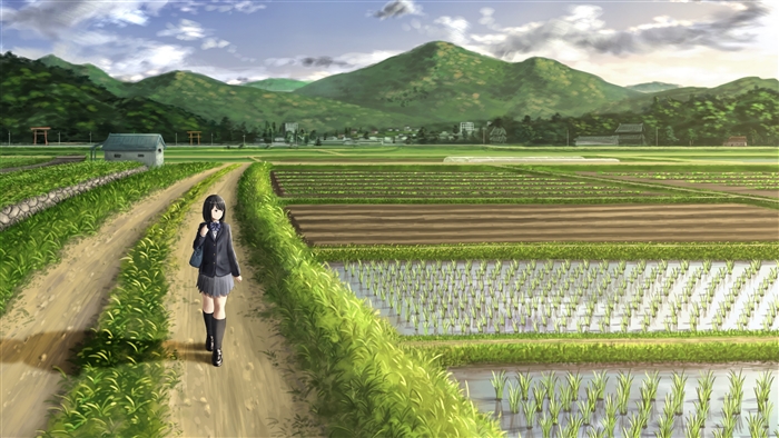 Girl with black hair walking on a dirt road through rice fields
