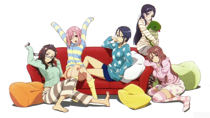 Five girls relaxing on a couch and beanbags