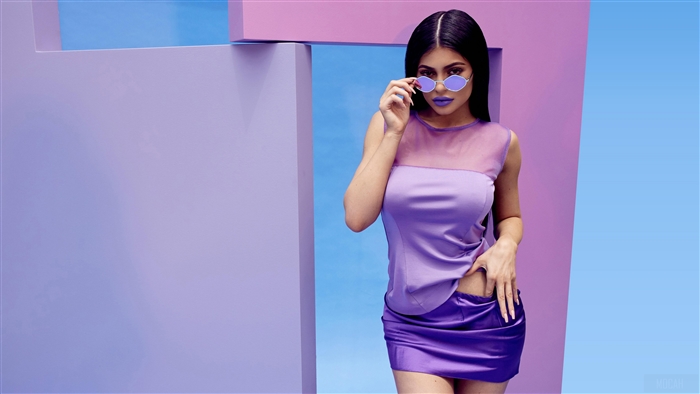 Kylie Jenner in purple outfit with sunglasses