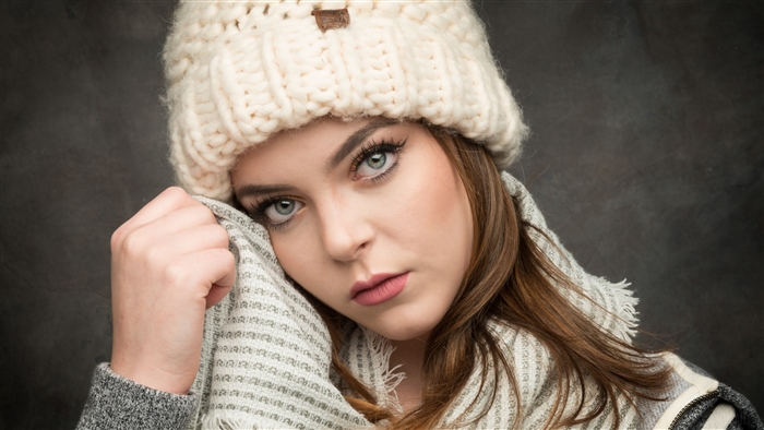 Portrait of Woman with Blue Eyes Wearing Winter Hat