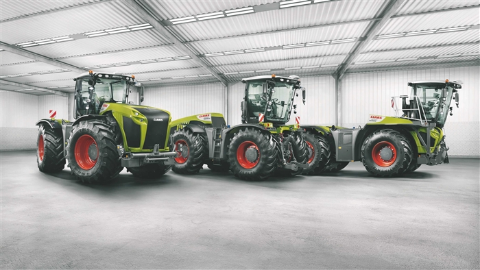 Three Claas Xerion Tractors in a Warehouse