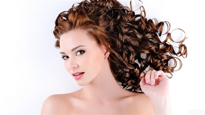Woman with long curly brown hair