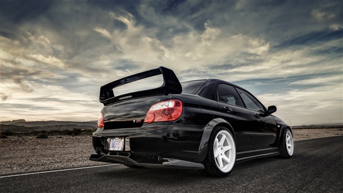 Black Subaru Impreza WRX STI with large spoiler