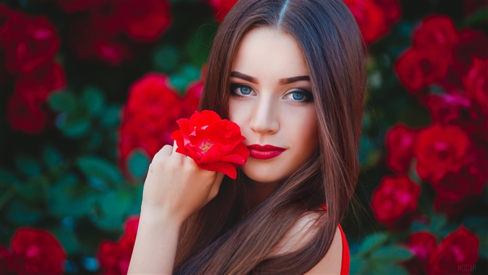 Brunette Woman with Red Flower and Blue Eyes