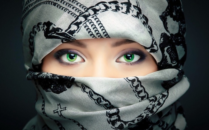Girl with green eyes wearing a patterned scarf