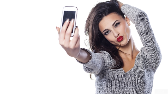 Brunette Woman Taking a Selfie with Red Lipstick