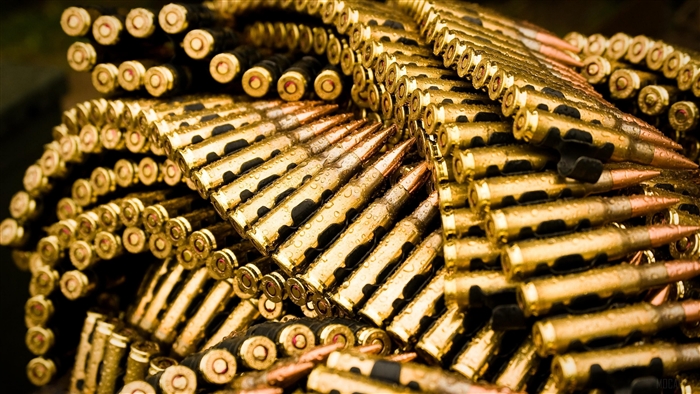 A belt of bullets with water droplets