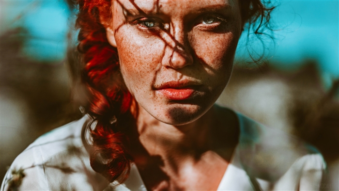 Woman with red hair and freckles