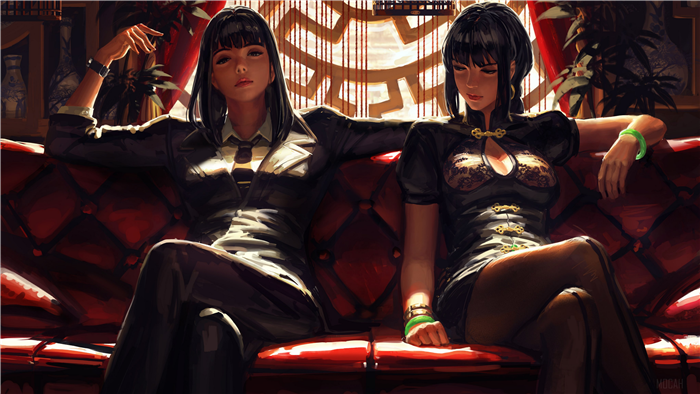 Two women in traditional Chinese dresses sitting on a couch