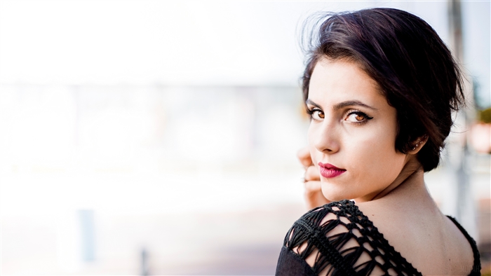 Woman with short dark hair and hazel eyes