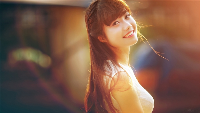 Young woman smiling in sunlight