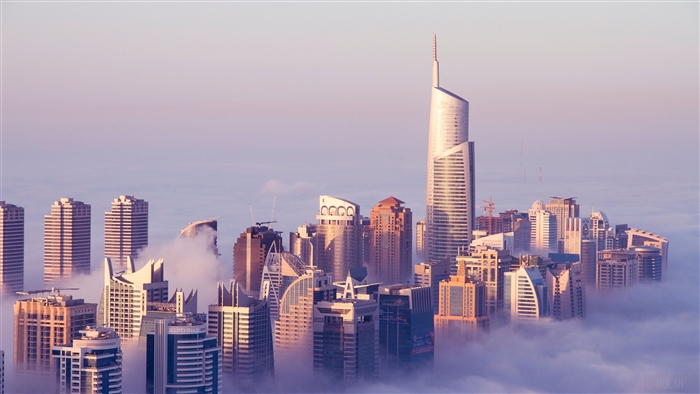 Dubai skyscrapers emerging from clouds, Jumeirah Lake Towers 4K