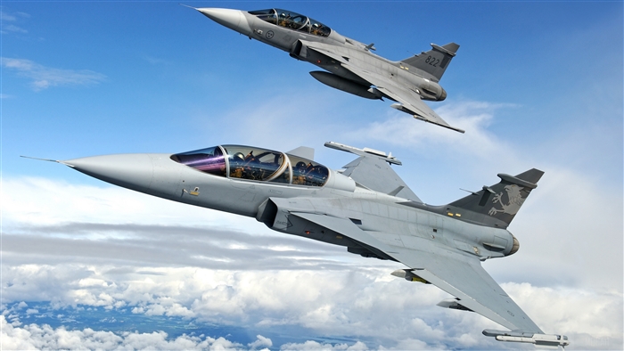 Two Saab JAS 39 Gripen fighter jets in flight