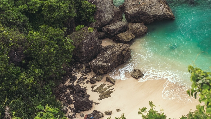 Tropical Cove with Rocks and Turquoise Water 4K