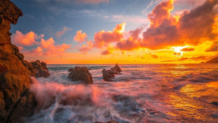 Vibrant Ocean Sunset with Clouds and Rocks 4K