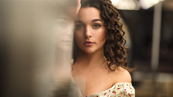 Curly Brunette Woman with Soft Reflection 4k