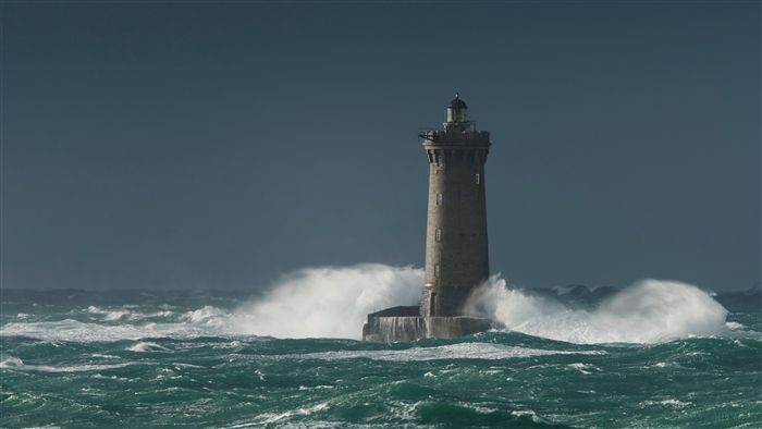 Lighthouse Standing Strong Amid Rough Ocean Waves 4k