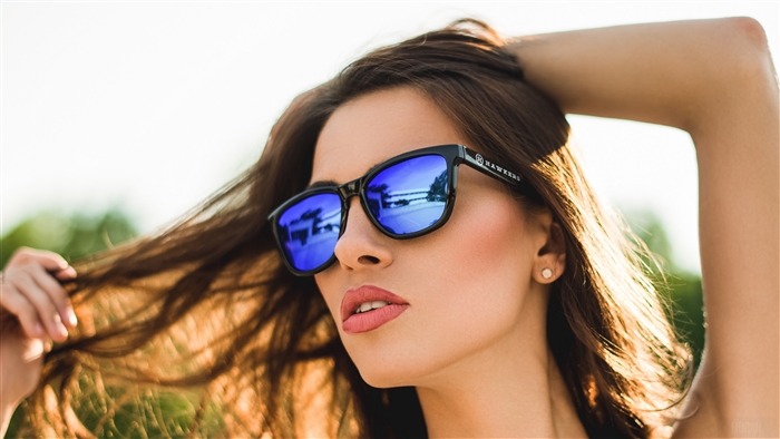 Woman wearing sunglasses with blue lenses