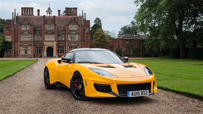 Yellow Lotus Evora Sport Car in front of a Mansion