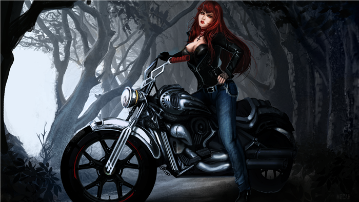 Woman with red hair on a motorcycle in a forest