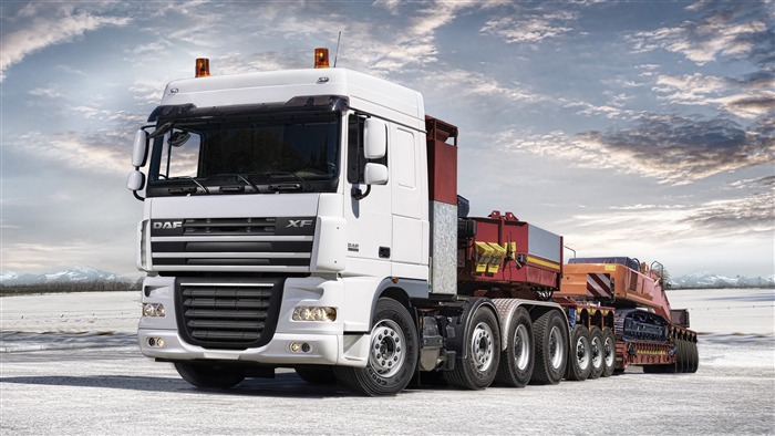 White DAF XF Semi Truck with Heavy Load