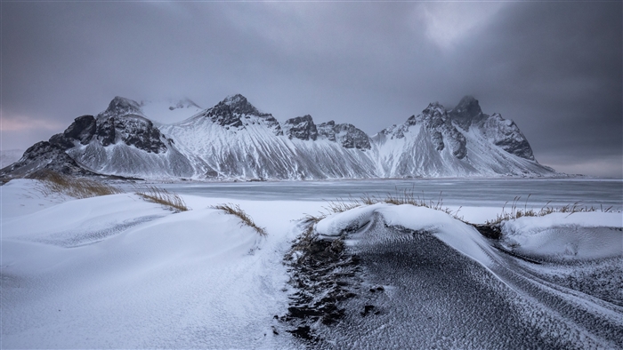 Snowy Mountains and Frozen Lake in Iceland 4K