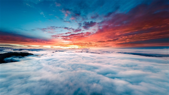 Sunset over clouds and mountains 4K