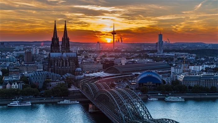 Cologne Cityscape with Hohenzollern Bridge at Sunset 4K