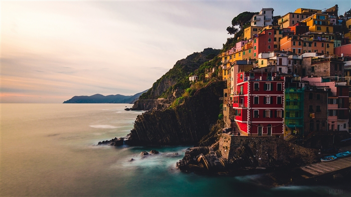 Colorful buildings on a cliff overlooking the sea in Riomaggiore 4K