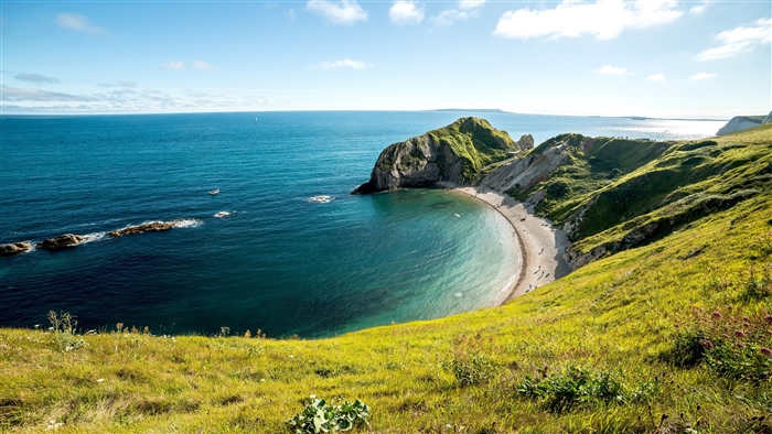 Durdle Door Coastline with Green Cliffs and Blue Sea 4K