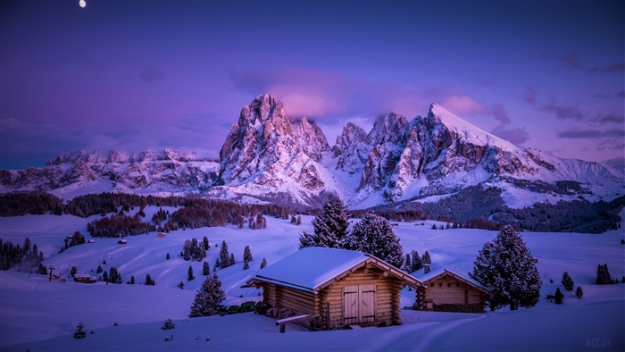 Snowy Cabin and Mountain Landscape in Winter