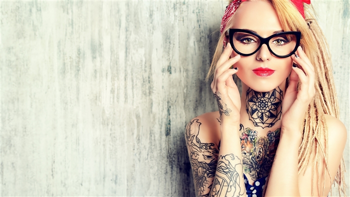 Woman with blonde dreadlocks, glasses, and tattoos 4K