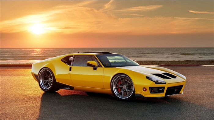 Yellow De Tomaso Pantera sportscar by the ocean at sunset 4K
