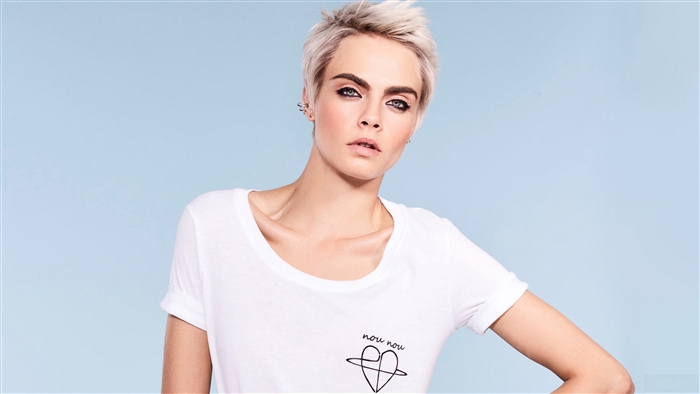Cara Delevingne in white t-shirt with heart logo