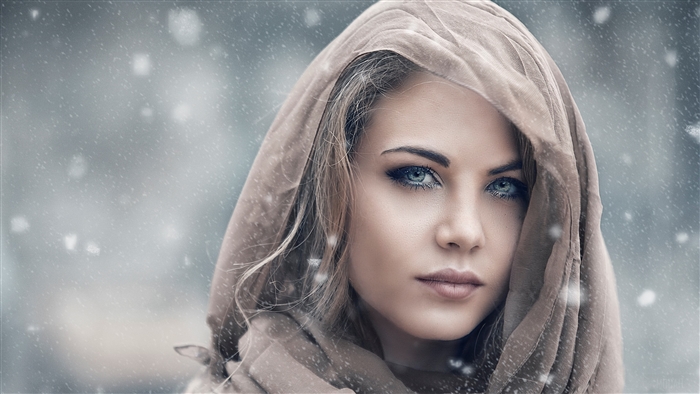 Woman in Scarf Gazing Through Snowfall 4K