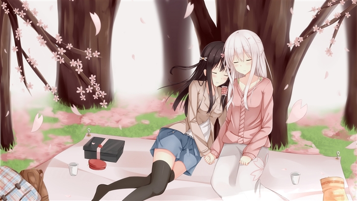 Two girls sleeping under cherry blossoms