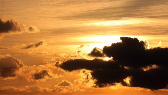 Sunset with orange clouds and sun