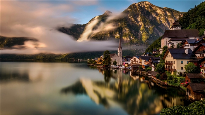 Hallstatt village on a lake with mountains and clouds