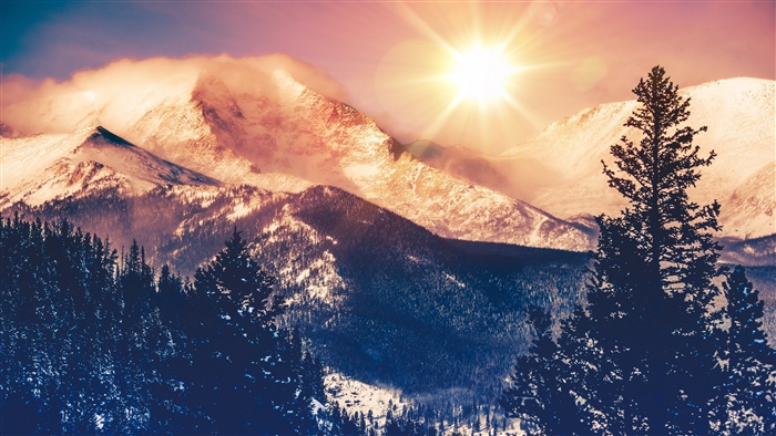 Snowy Mountains with Sunbeams and Forest