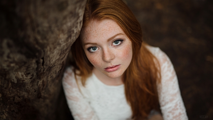 Woman with red hair and freckles