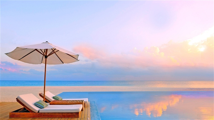 Infinity Pool and Beach Umbrella at Sunset 4K