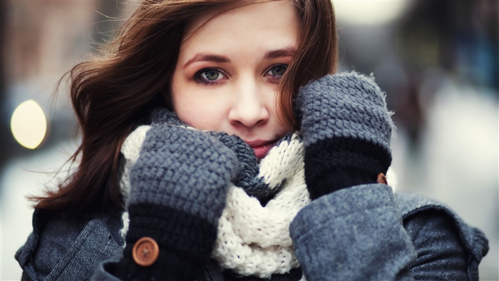 Winter Portrait of Woman with Green Eyes in Gloves