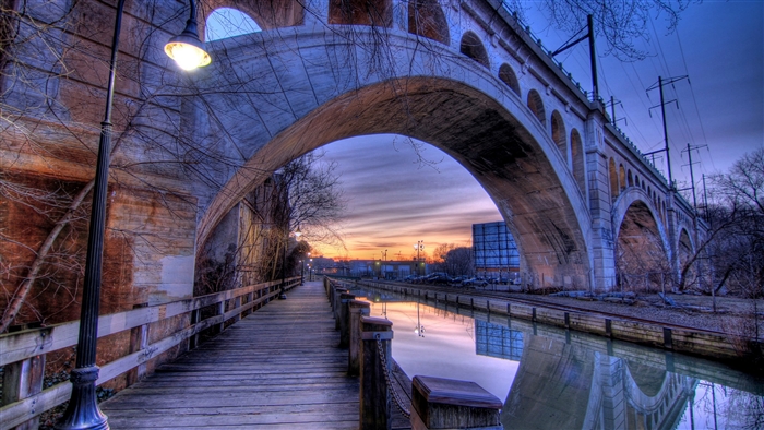Bridge over canal at sunset