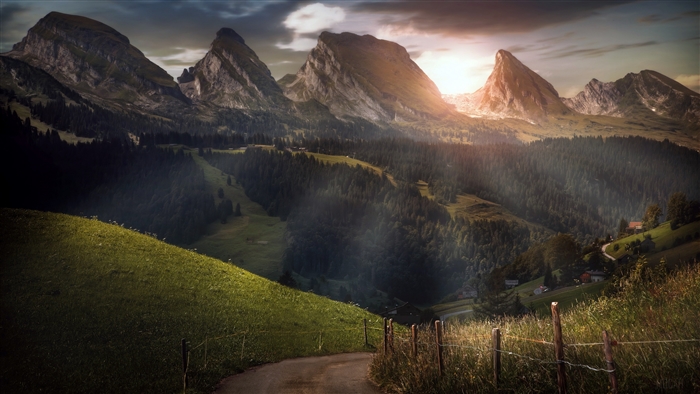 Mountain landscape with road and fence in Switzerland 4K