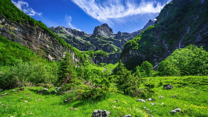 Mountain valley with waterfalls and green grass 4K