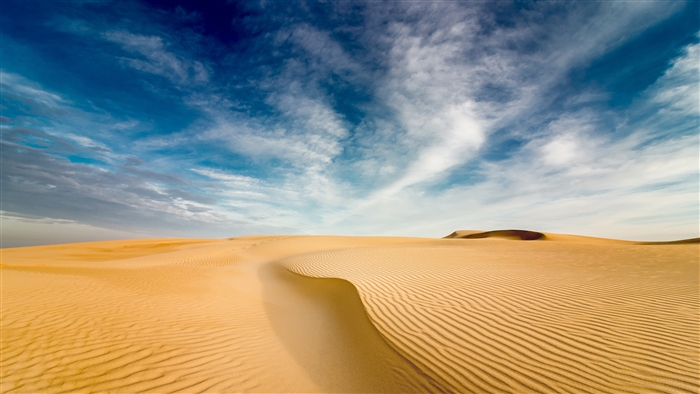 Expansive Desert Landscape with Blue Sky and Clouds