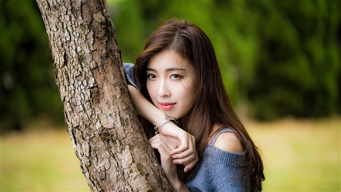 Brunette Woman by Tree in Soft Natural Light 4k