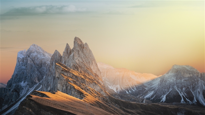 Sunbeam Illuminating Rugged Mountain Peaks 4K
